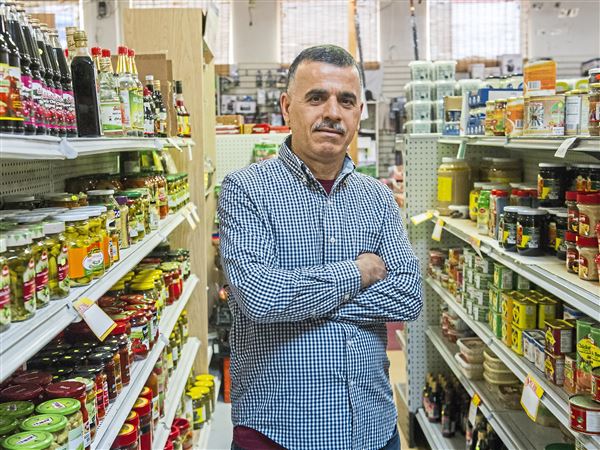 Man standing in Sultan Bey grocery store